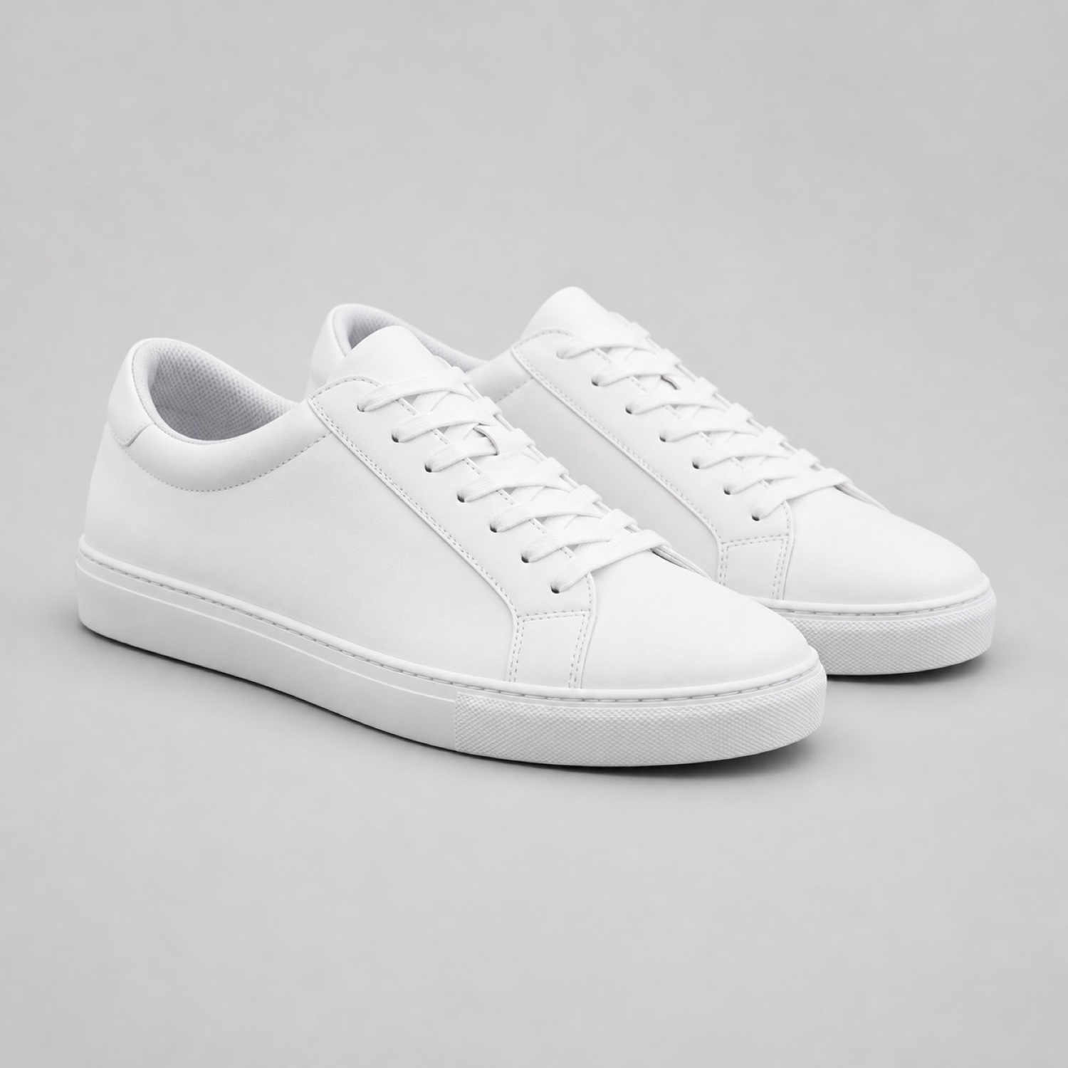 Change the sneakers from white to sage green while preserving every material detail. (Before)